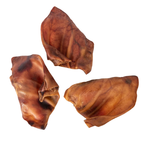 Overhead view of Pig Ears showcasing three brown dog chews on a transparent background