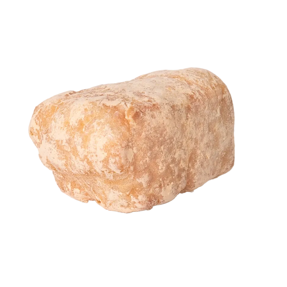 Side view of Peanut Butter Yak Cheese Puffs showcasing a rough cylindrical texture with a transparent background