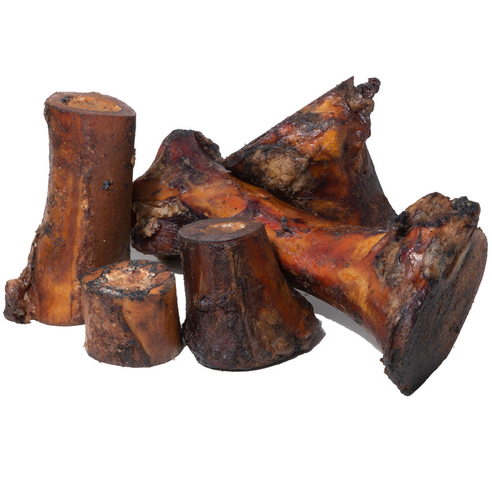 Hickory smoked beef marrow bones in varying sizes with natural dark color