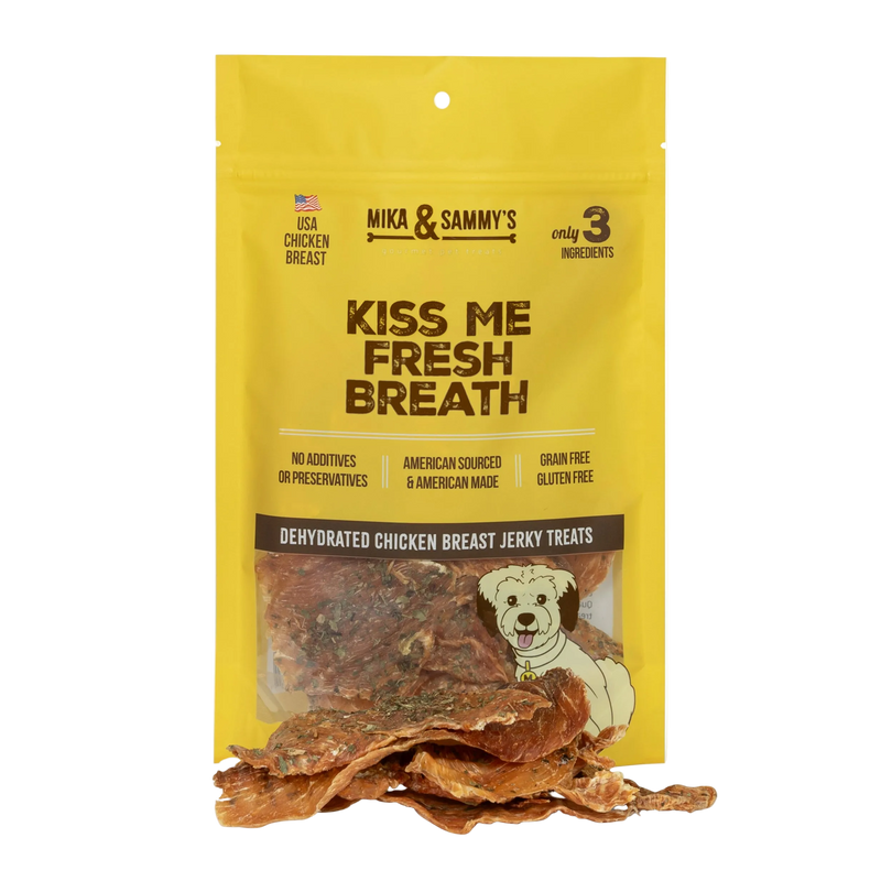 Front view of Kiss Me Fresh Breath dog treats showcasing dehydrated chicken breast jerky treats in a yellow package