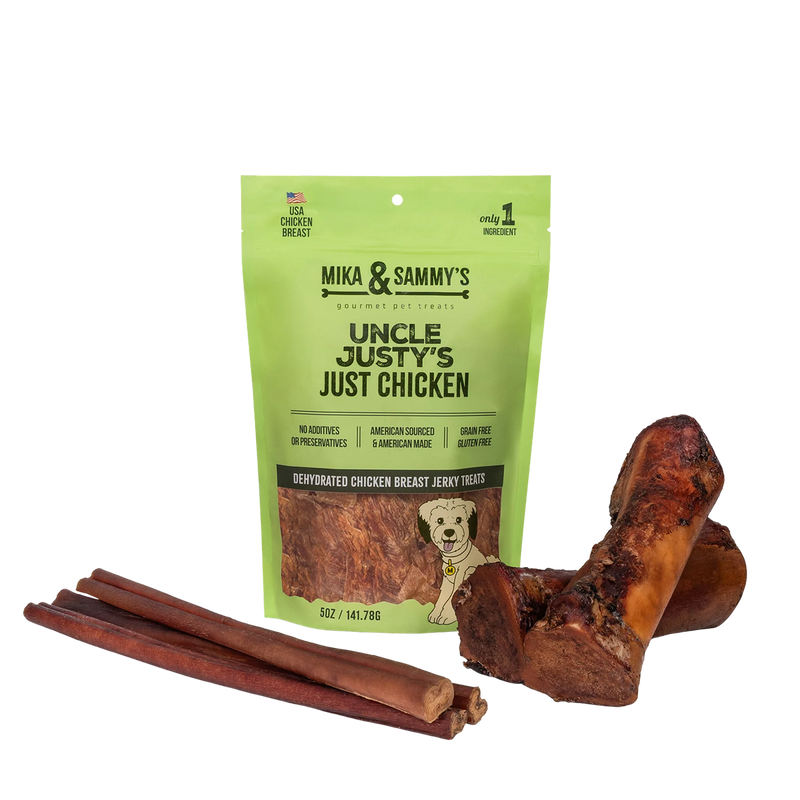 Front view of Large Dog Summer Treat Bundle showcasing chicken jerky, smoked marrow bones, and bully sticks on a black background