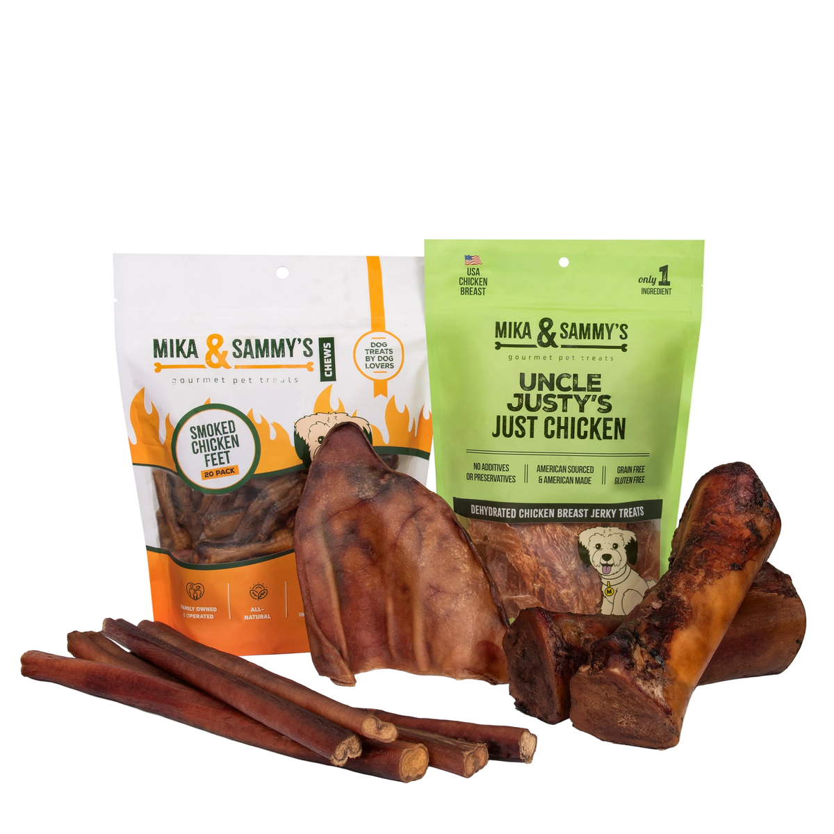 Front view of a pet treat bundle showcasing smoked chicken feet, chicken jerky treats, bully sticks, and chews on a transparent background