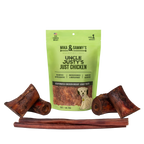 Front view of Medium Dog Summer Treat Bundle showcasing a green chicken jerky bag and assorted dog chews on a transparent background