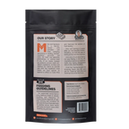 Back view of Philly Beef Cheesesteak treat package showcasing its story, feeding guidelines, ingredients, and barcode on a black background