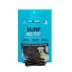 Front view of Surf and Turf dog treats showcasing blue packaging with beef liver and fish jerky treats on black background