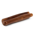 Close-up of two Monster Beef Cheek Sticks showing rolled hollow center and firm brown chew texture on a white background