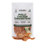 Front view of Philly Chicken Cheese dog treats showcasing chicken breast and cheese jerky treats in a white package