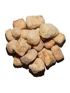 Close-up of Peanut Butter Yak Cheese Puffs showcasing crunchy puff texture and 100% Himalayan yak cheese on plain background