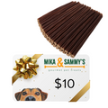 Angled view of 25 6-inch beef gullet sticks with a Mika & Sammy’s gift card featuring a gold bow and dog photo on white