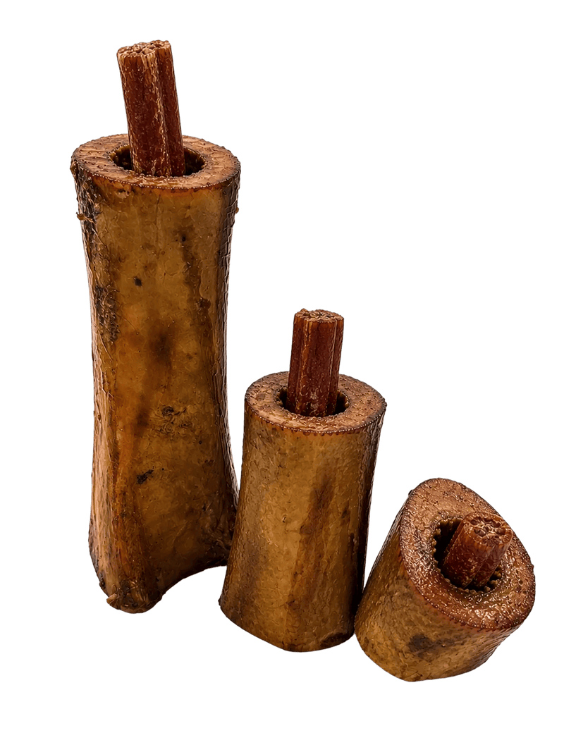 Three smoked beef marrow bones showcasing stuffed centers on a transparent background